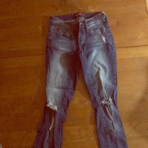 Cute jeans with holes in the legs  size 5